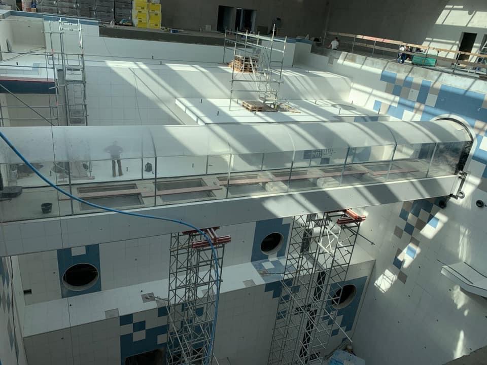 PMMA acrylic viewing panel installed pre-water condition — panel seated and sealed, awaiting pool or aquarium fill