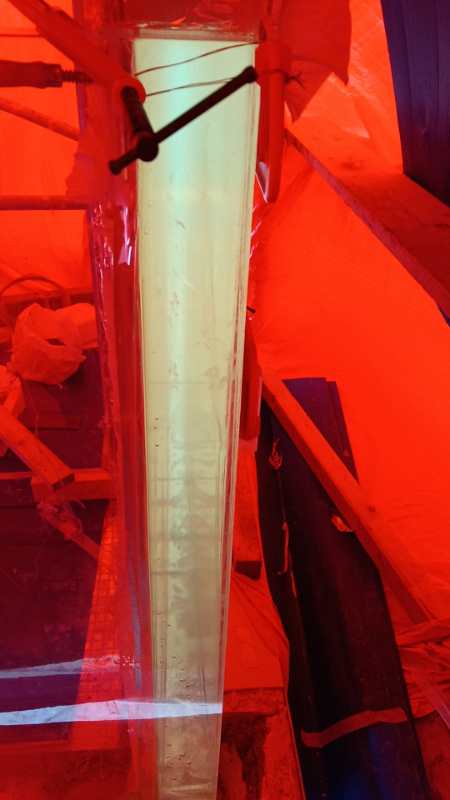 Close-up of the on-site panel joint during installation of the transparent pool wall in Vietnam